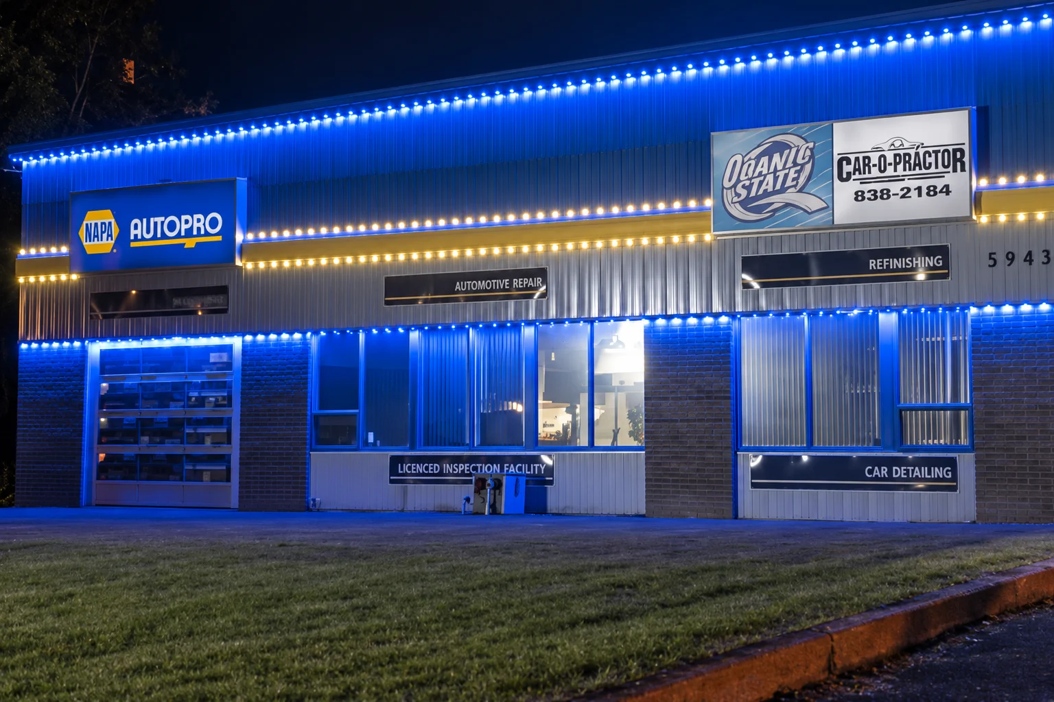A commercial storefront illuminated with blue lighting