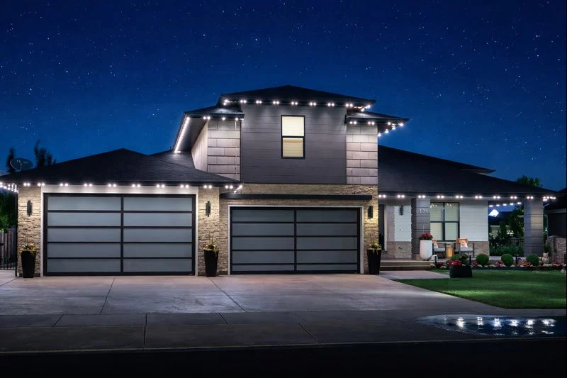 White architectural lighting along a modern home