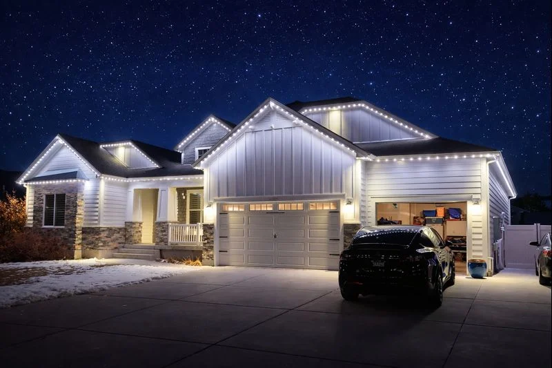 A wide home illuminated in white lighting